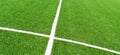 Green artificial grass turf soccer football field background with white lines. Top view Royalty Free Stock Photo