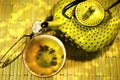 Green asian teapot with cup