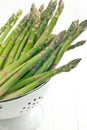 Green asparagus in colander