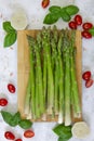 Green asparagus on a light background ready to be cooked or grilled Royalty Free Stock Photo