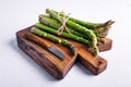 Green asparagus sprout on wooden board