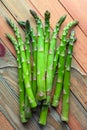 Green asparagus sprout on wooden board