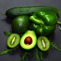 Green assortment vegetables and fruits, avocados, kiwi, pepper and cucumber on a shale board, the concept of healthy eating, copy Royalty Free Stock Photo