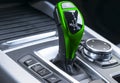 Green Automatic gear stick of a modern car. Modern car interior details. Close up view. Car detailing. Automatic transmission leve