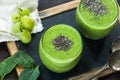 Green avocado, spinach and grape smoothie with chia seeds Royalty Free Stock Photo