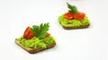 Green Avocado and Tomato Crackers topped with Parsley Royalty Free Stock Photo