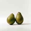 Environmental Portraiture Of Two Avocados On White Surface