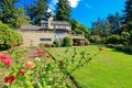 Green back yard garden with nice flowers. Royalty Free Stock Photo