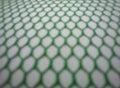 Green background blur nets with hexagon hole shape