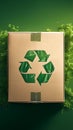 Green background with cardboard box featuring recycle symbol, eco concept Royalty Free Stock Photo