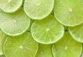 Green background with citrus-fruit of lime slices Royalty Free Stock Photo