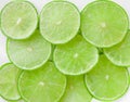 Green background with citrus-fruit of lime slices Royalty Free Stock Photo