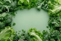 Green background with frame of lettuce and broccoli. Background with copy space Royalty Free Stock Photo