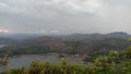 Green background, majestic looking river with high hills, green nature