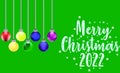 Green background and multicolored pattern for Christmas 2022. Royalty Free Stock Photo