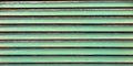 Green background old metal gate striated planks texture Royalty Free Stock Photo