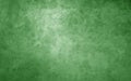 Green background with texture. Soft shiny Christmas green color with mottled marbled old vintage grunge texture