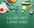 A green background with a white box that says learn new languages Royalty Free Stock Photo