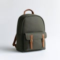 A green backpack with brown leather straps on a white background Royalty Free Stock Photo
