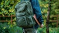 The green backpack in nature.AI generated image Royalty Free Stock Photo