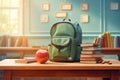 A green backpack in school classroom on the desk. School stationery, stationery, red apple, books, notebooks Royalty Free Stock Photo