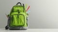 The green backpack with supplies.AI generated image Royalty Free Stock Photo