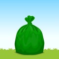 Green bag plastic garbage on grass sky background, bin bag, garbage bags for waste, pollution plastic bag waste, 3r ad, waste