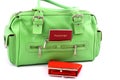 Green bag and red wallet Royalty Free Stock Photo