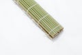 Green bamboo place mat on white background Royalty Free Stock Photo