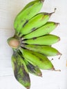 GREEN BANANA BUNCH ORGANIC FRUIT WHITE TEXTURE BLUR BACKGROUND Royalty Free Stock Photo