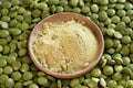 Green barley grass powder in a bowl with barleygrass tablets Royalty Free Stock Photo