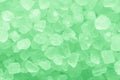 Green bath aroma salt crystal grains closeup. Template for labels and packaging, texture for articles and posts Royalty Free Stock Photo