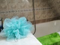 green bath body sponge laid in the bathroom Royalty Free Stock Photo