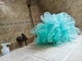 green bath body sponge laid in the bathroom Royalty Free Stock Photo