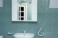 Green bathroom detail with mirror Royalty Free Stock Photo