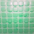 Green Bathroom Tiles With Soap Scum Suds on them. AI Image