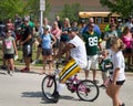 Green Bay Packer Player Riding Bike with Young Fan