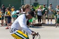 Green Bay Packer Player Riding Bike with Young Fan