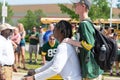 Green Bay Packer Player Riding Bike with Young Fan