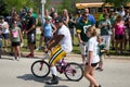 Green Bay Packer Player Riding Bike with Young Fan