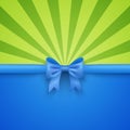 Green beam background with blue gift bow and