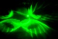 Green beam laser on a dark background. Abstraction