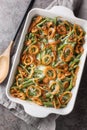 Green bean casserole is an American baked dish consisting of green beans, cream of mushroom soup, and french fried onions on the Royalty Free Stock Photo