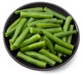 Green beans in a black plate isolated on white background. Clipping path and full depth of field Royalty Free Stock Photo