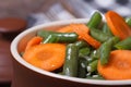 Green beans with chopped carrots and sesame seeds Royalty Free Stock Photo