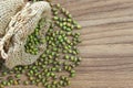 Green beans in sack, on wooden texture background with free space Royalty Free Stock Photo