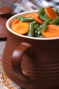 Green beans with sliced ??carrots in a pot Royalty Free Stock Photo