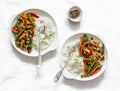 Green beans, sweet peppers, carrots, onions, green peas stir fry and rice on a light background, top view. Fast diet vegetarian