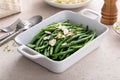 Green beans topped with almonds in a baking dish, traditional side dish for dinner or celebration Royalty Free Stock Photo