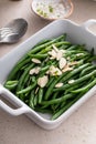 Green beans topped with almonds in a baking dish, traditional side dish for dinner or celebration Royalty Free Stock Photo